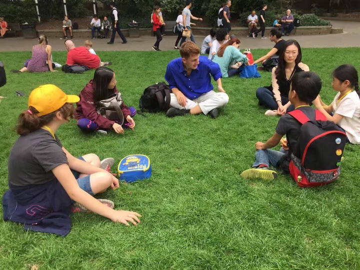 Children and Athena Tuition tutor having a picnic at the Natural History Museum